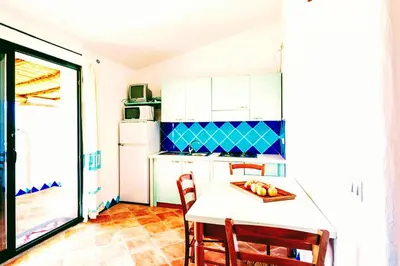 Cucina o angolo cottura di Orosei RE - Il Paradiso degli Ulivi con PISCINA e vista mare