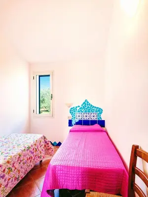 Letto o letti in una camera di Orosei RE - Il Paradiso degli Ulivi con PISCINA e vista mare