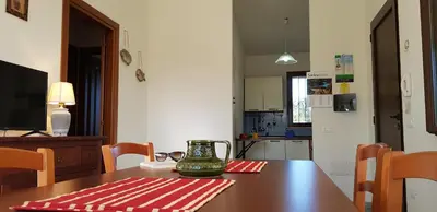 TV o dispositivi per l'intrattenimento presso La Solidea - Villa con giardino a pochi passi da Cala Ginepro