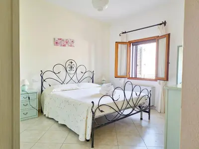Letto o letti in una camera di Le Domosolas - Appartamenti in centro storico a Orosei