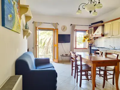 Cucina o angolo cottura di Le Domosolas - Appartamenti in centro storico a Orosei