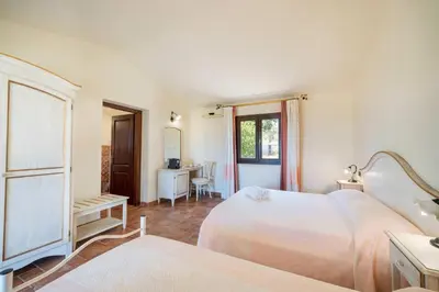 Letto o letti in una camera di Borgo Alba Barona Turismo Rurale