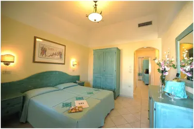 Letto o letti in una camera di Residence Cala Liberotto