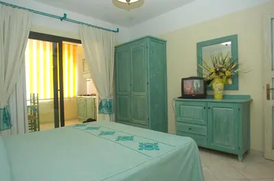 Letto o letti in una camera di Residence Cala Liberotto