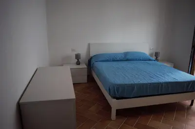 Letto o letti in una camera di VILLA FRANCESCA con vista mare La caletta SARDEGNA