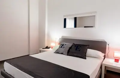Letto o letti in una camera di L'Essenza Hotel