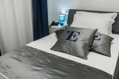 Letto o letti in una camera di L'Essenza Hotel
