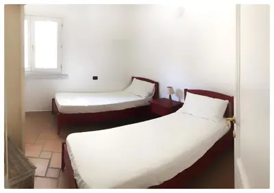Letto o letti in una camera di Incanto Apartment Golfo Aranci
