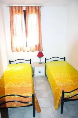 Letto o letti in una camera di Casa ARCU DE CHELU