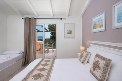 Letto o letti in una camera di VOI Colonna Village