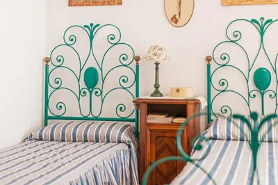 Letto o letti in una camera di Casa Lentischio