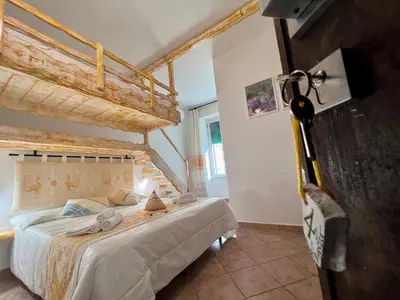 Letto o letti in una camera di Affittacamere Le Ginestre