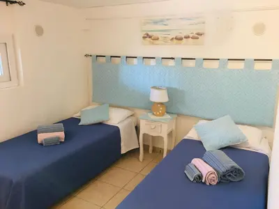 Letto o letti in una camera di Beach House Ilaria- Smeraldo Apt