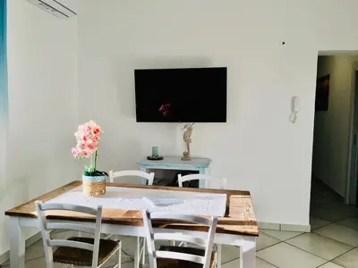 TV o dispositivi per l'intrattenimento presso Beach House Ilaria - Turchese Apt