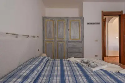 Letto o letti in una camera di Holiday home in Golfo Aranci 30357