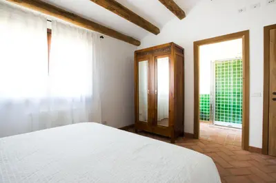 Letto o letti in una camera di Case Vacanze S'Arrexina