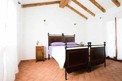 Letto o letti in una camera di Case Vacanze S'Arrexina