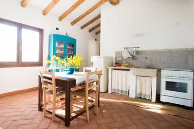 Cucina o angolo cottura di Case Vacanze S'Arrexina