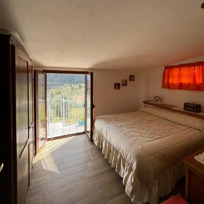 Letto o letti in una camera di Villetta con giardino e barbecue