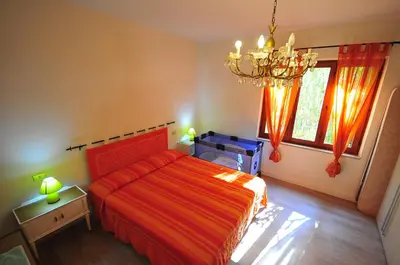 Letto o letti in una camera di RESIDENZA I MELOGRANI