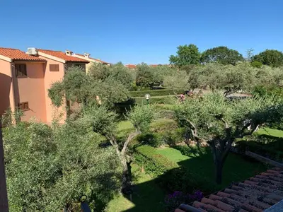 Giardino di Bilocale Residence Gli Ulivi San Teodoro
