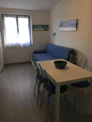 Area soggiorno di Bilocale Residence Gli Ulivi San Teodoro