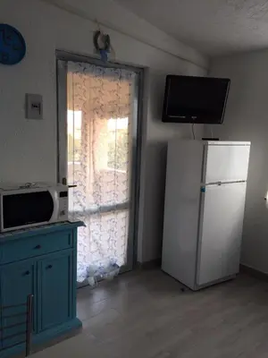 Cucina o angolo cottura di Bilocale Residence Gli Ulivi San Teodoro