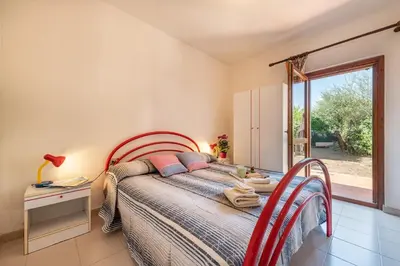 Letto o letti in una camera di Apartment in San Teodoro 23071