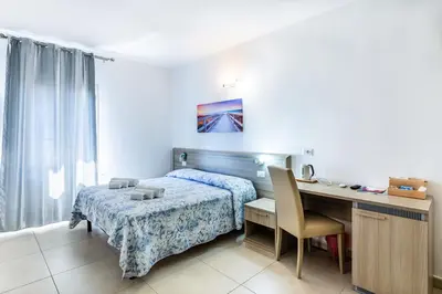 Letto o letti in una camera di Affittacamere Blue Sea