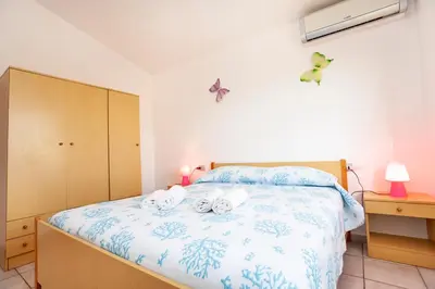 Letto o letti in una camera di Villino Bilo Centro