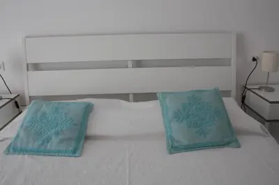Letto o letti in una camera di Gli olivi