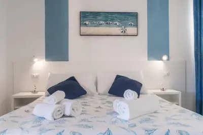 Letto o letti in una camera di Caletta sul Mare