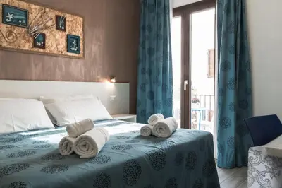 Letto o letti in una camera di Caletta sul Mare