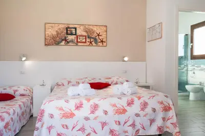 Letto o letti in una camera di Caletta sul Mare