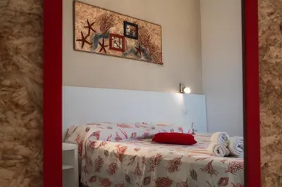 Letto o letti in una camera di Caletta sul Mare