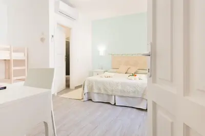 Letto o letti in una camera di Casa Berenice