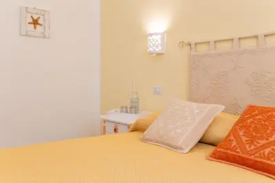 Letto o letti in una camera di Casa Berenice