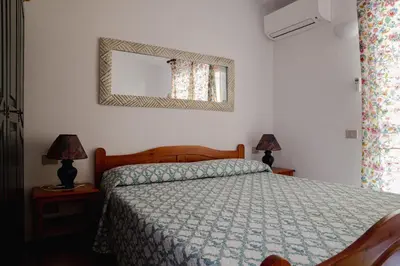 Letto o letti in una camera di Isola Alta - BUDONI SWEET HOME