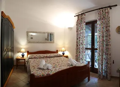 Letto o letti in una camera di Isola Alta - BUDONI SWEET HOME