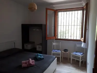 Letto o letti in una camera di Corbezzolo