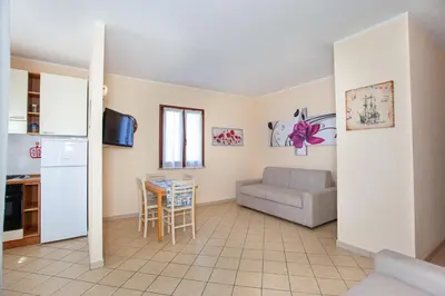 TV o dispositivi per l'intrattenimento presso Le Residenze Blu Sardinia