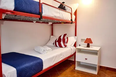 Letto o letti in una camera di La Meridiana IUN P2300