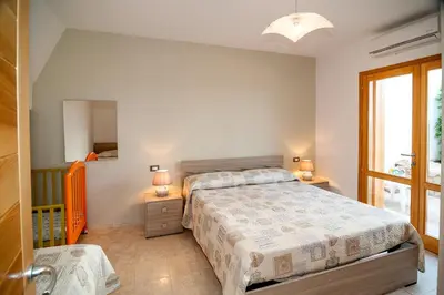Letto o letti in una camera di Sant'Anna Fabulous Apartment