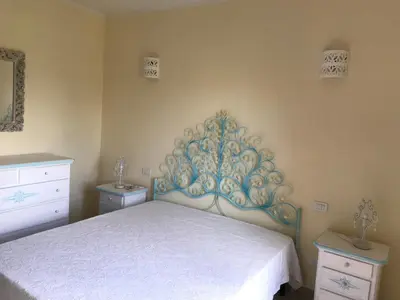 Letto o letti in una camera di Residence Cala Moresca