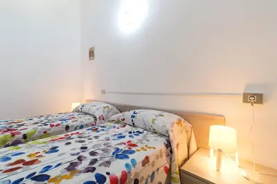 Letto o letti in una camera di Near The Port Apartment