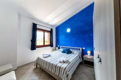 Letto o letti in una camera di Residence Le Ginestre / Ataras
