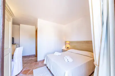 Letto o letti in una camera di Hotel il Faro di Molara