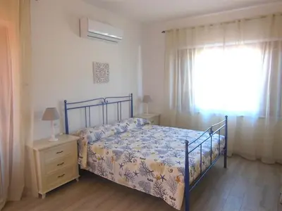 Letto o letti in una camera di PUNTO ZERO ROOMS