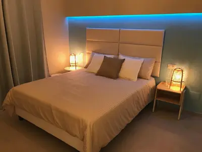 Letto o letti in una camera di ESMERALDA'S ROOMS