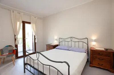 Letto o letti in una camera di Lu Lioni Rooms